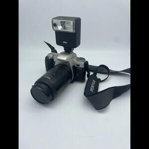 Pentax Silver and Black SLR Camera with Flash